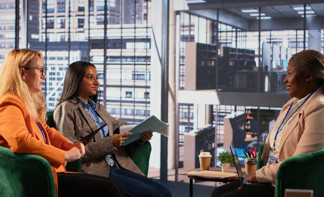 Colleagues in discussion during a workplace meeting